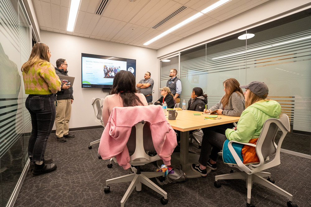 Explore program students watching the administration presentation.